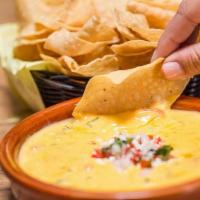 Queso  · Our Signature Velvety-Queso. Served with fresh Chips.