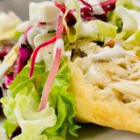 Chicken Flautas (2) · Two traditional shredded Chicken Flautas, topped with lettuce, slaw, sour cream, and cheese....