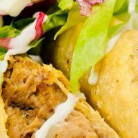 Beef Flautas (2) · Two signature shredded Beef Flautas, topped with lettuce, slaw, sour cream, and cheese. Serv...