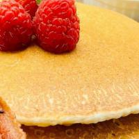 Raspberry Pancakes · Two fluffy pancakes with our original raspberry medley syrup, and three crisp bacon strips. ...