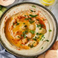 Hummus Bowl · Topping with olive oil, paprika, cucumbers, chickpeas, side of spicy sambal sauce, served wi...
