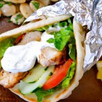 Chicken Shawarma Sandwich · Marinated Grilled Chicken with special Shawarma spices wrapped with choice of pita bread or ...