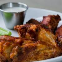 Baked Wings · Baked wings. Option of mild, spicy, or honey bbq. Served with choice of home made ranch or b...