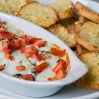 Spinach Artichoke Dip · Organic spinach, choice of toasted baguette or corn chips (chips make item gluten sensitive).