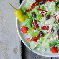 Greek Salad · Romaine, cucumbers, organic grape tomatoes, sun-dried tomatoes, feta, Kalamata olives, peppe...