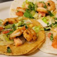 Shrimp Tacos (3) · On flour tortilla w/lettuce, tomato, onion and cilantro.