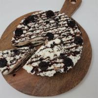 Oreo Custard Pie · A whole custard pie, homemade in our store. Oreo crust, vanilla and chocolate swirl custard,...
