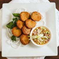 Fish Cake (8) · Gluten free. Fish blended with red curry paste, sweet diced green bean, and basil leaf. Serv...