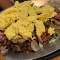 Cadillac Skillet · Cadillac square specialty. Grilled bacon, sausage, ham, onions, green pepper, mushrooms and ...
