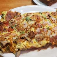 Cadillac Square Omelette · Cadillac square specialty. Filled with mushrooms, bacon, sausage, ham, onions, green pepper,...