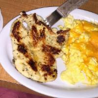 Grilled Chicken & Eggs · 1 piece of grilled chicken with 3 extra large eggs, with hash browns or grits or pancakes.