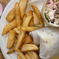 Greek Chicken Wrap · Served with lettuce, tomatoes, feta cheese, pepperoncini, onions and a side of Greek dressing.