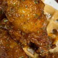 Chicken & Waffles · 3 chicken tenders served over a delectable waffle. Choice of maple syrup or our signature ho...