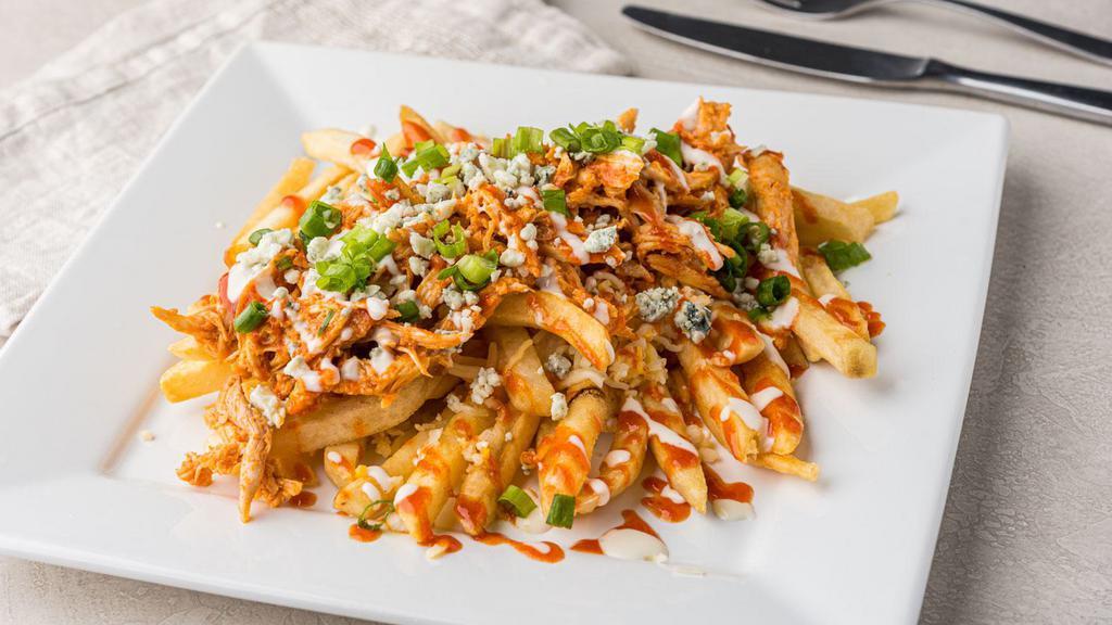 Buffalo Chicken Fries · Crispy fries smothered with Mexican blend cheese, shredded chicken seasoned in our signature Bayou sauce, finished with ranch dressing, blue cheese crumbles, and green onions.
