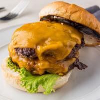 Double Cheeseburger · Whoa!  TWO 1/3 pound Angus beef patties topped with cheddar cheese and dressed with lettuce,...