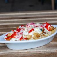 Cheesy Fries · Thick cut fries served w/ our house blend of  queso cheese and green hatch chilis, sweet che...