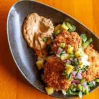 Crab Cakes · Not so spicy. Maryland style, spicy tartar, mango salsa.