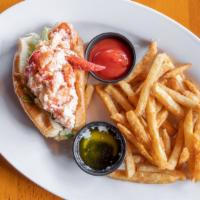 Lobster Roll · chilled lobster on a warm New England style bun, mayo, melted butter, served with fries.