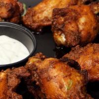 Nola Wings · Marinated deep-fried jumbo chicken wings tossed in house Cajun sauce, served with ranch.