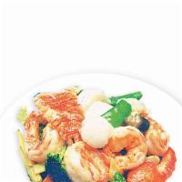 Seafood Combination · Fresh lobster meat, scallops, jumbo shrimp, crab meat and squid sauteed with assorted vegeta...