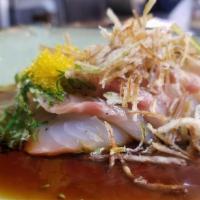 Japanese Crudo · white fish sashimi, fresh herbs, negi oil, and ponzu.