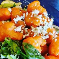 Buffalo Cauliflower · Deep-fried cauliflower bites tossed in a signature buffalo sauce and topped with blue cheese...