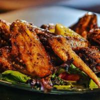 Henny Wings · Four whole Chicken wings deep-fried and tossed in our signature Hennessey sauce, served with...