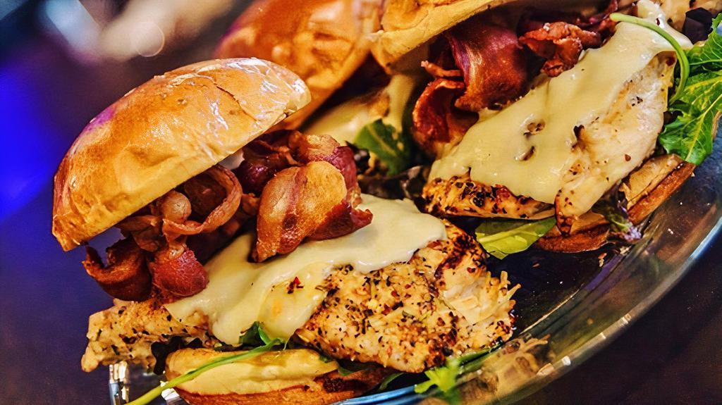 Issa Vibe Sandwich · Chargrilled Chicken breast topped with hickory bacon, mixed greens, tomato and our signature sauce served on a brioche bun. Served with Fresh Cut Seasoned fries