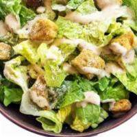 Caesar Salad · Fresh cut romaine lettuce, premium croutons, Caesar dressing and parmesan cheese.