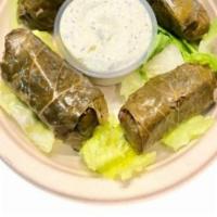 Dolmas ( 4 Pcs) · Combination of rice, parsley, mint and a twist of lemon juice, wrapped in grape vine leaves....