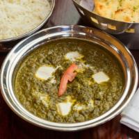 Palak Paneer · Chopped spinach cooked with cottage cheese with a hint of spices.