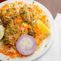 Murg Biryani · Saffron flavored basmati rice cooked with succulent pieces of chicken in a blend of exotic h...