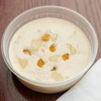 Kheer Badami · Traditional rice pudding blended and topped with slivered almonds.
