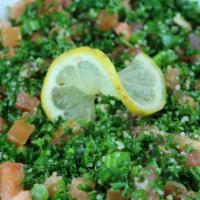 Tabbouleh Salad · Chopped parsley, mint, fresh tomatoes, green onions and bulgur wheat tossed in special house...