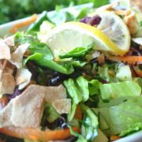 Fatoush Salad · Delightful age-old recipe of crisp romaine lettuce, cabbage, carrots, tomatoes, cucumbers, o...