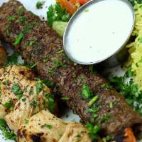 Kabob-E- Sultani · A skewer of beef koobideh and chicken shish kabob served with basmati rice, house feta salad...