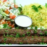 Beef Koobideh Platter · 2-skewers of finely minced beef seasoned with special spices served with basmati rice, house...