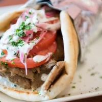 Gyro Wrap · Juicy tender, lean blends of beef and lamb seasoned with zesty Greek spices, roasted on vert...