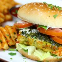 Say Cheese Burger (Vegetarian) · Slices of goat & sheep cheese sautéed in olive oil & herbs then drizzled with basil pesto sa...