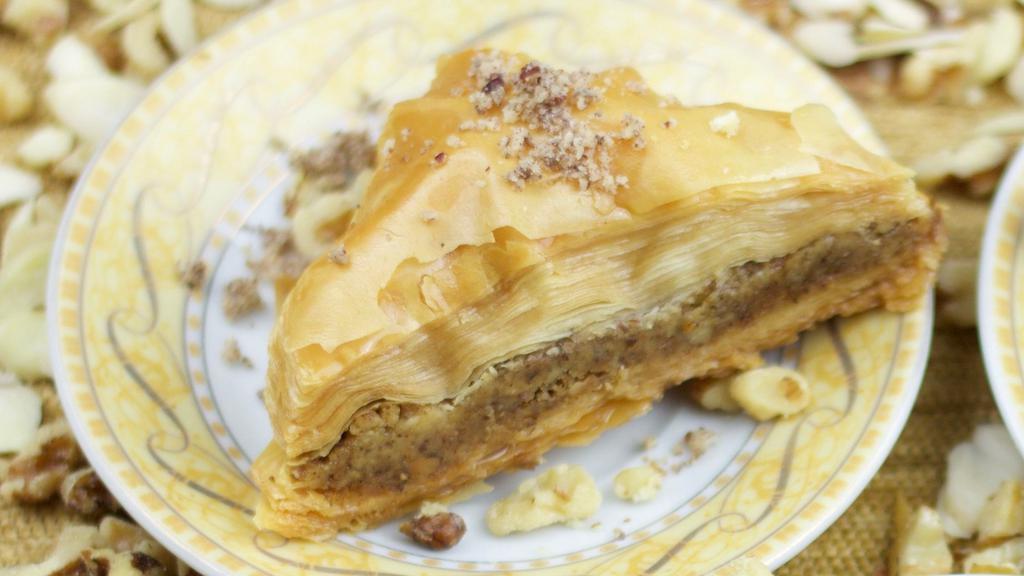 Homemade Baklava · A rich and crispy Greek/Middle Eastern pastry consisting of sheets of phyllo layered with chopped nuts, chocolate or coconut, baked to perfection and brushed with butter, cinnamon, honey and a hint of rose water