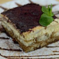 Tiramisu · A creamy dessert of espresso-soaked ladyfingers surrounded by lightly sweetened whipped crea...