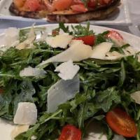 Arugula · organic arugula, lemon, olive oil, halved grape tomatoes