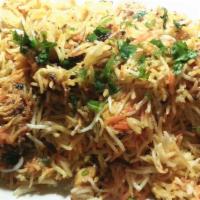Chicken Biryani · Long grain basmati rice steamed with semi prepared chicken stew with rich spices and condime...