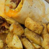 All American Burrito · Two scrambled eggs, cheddar cheese, carne asada, bacon, breakfast potatoes and chipotle mayo...