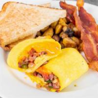 Western Omelette · Three egg omelette with ham, green pepper, onion, tomatoes and cheese served with home fries...