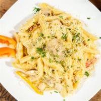 Chicken Pasta · Penne pasta sautéed with bell peppers and onions cooked in a jerk alfredo sauce.