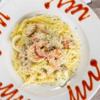 Pasta Plus · Penne Pasta Sautéed with bell peppers and onions cooked in a creamy jerk alfredo sauce with ...