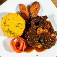 Oxtail With Butter Beans · Served with your choice of white rice, yellow rice or rice and peas, cabbage and plantains.
