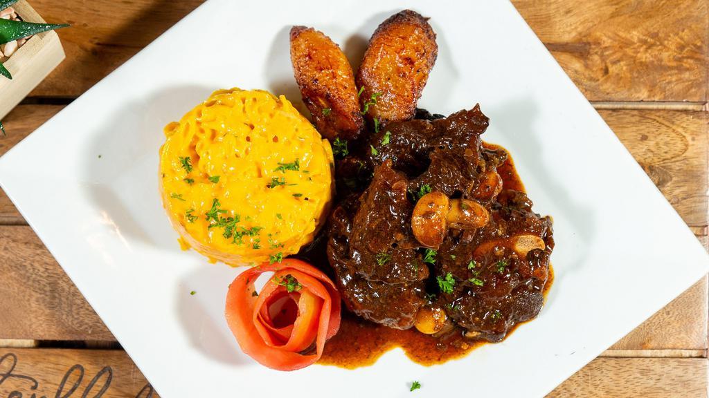 Oxtail With Butter Beans · Served with your choice of white rice, yellow rice or rice and peas, cabbage and plantains.