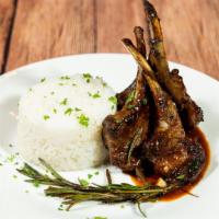 Roasted Rack Of Lamb · Served with your choice of white rice yellow rice rice and beans and steamed cabbage with 2 ...